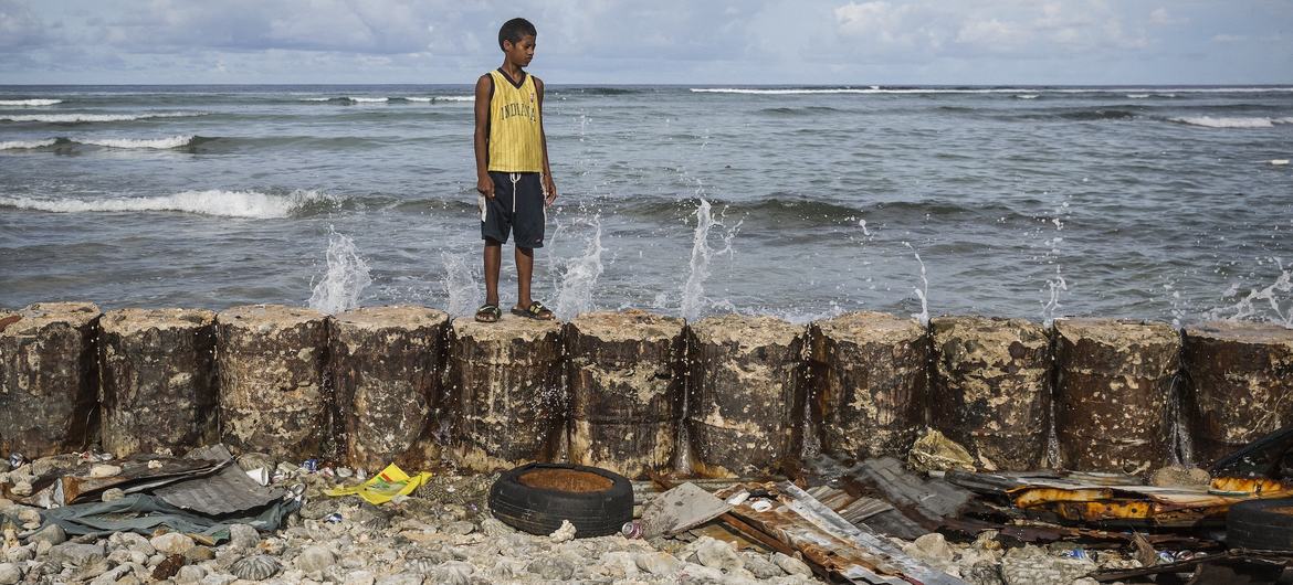 Even with a seawall, high tides flood the yard of this 13-year-old’s home in Majuro Atoll, Marshall Islands.