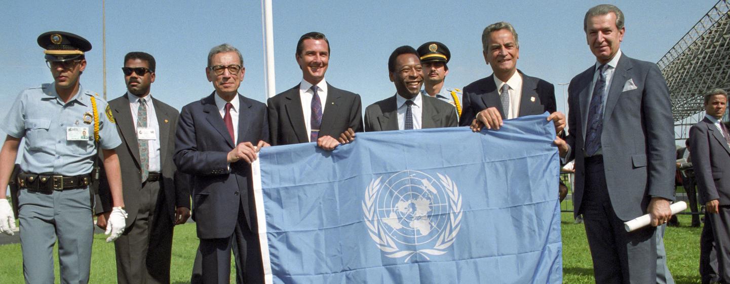 Opening the 1992 Rio Earth Summit, UN Secretary-General Boutros Boutros-Ghali (3rd from left) presents the UN flag to (from left to right) President Collor De Mello of Brazil, soccer superstar and UN Goodwill Ambassador Pele, Marcelo Alencar, Mayor of Ri…