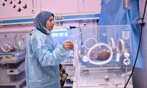 A nurse checks a newborn child at a neonatal intensive care unit of a hospital in rural Damascus, Syria. (file)