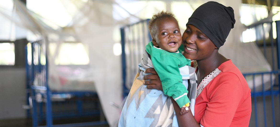A woman and her baby in Uganda at the Itojo Hospital's pediatric ward, which had no malaria cases due to UNICEF and Ministry of Health interventions, including mosquito nets.