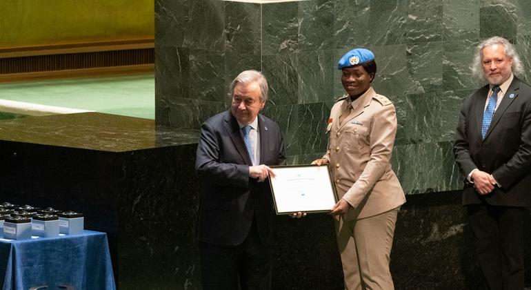The UN Secretary-General António Guterres  (left) presents the 2022 Military Gender Advocate of the Year Award to Captain Cecilia Erzuah from Ghana who served with the UN Interim Security Force for Abyei (UNISFA). 