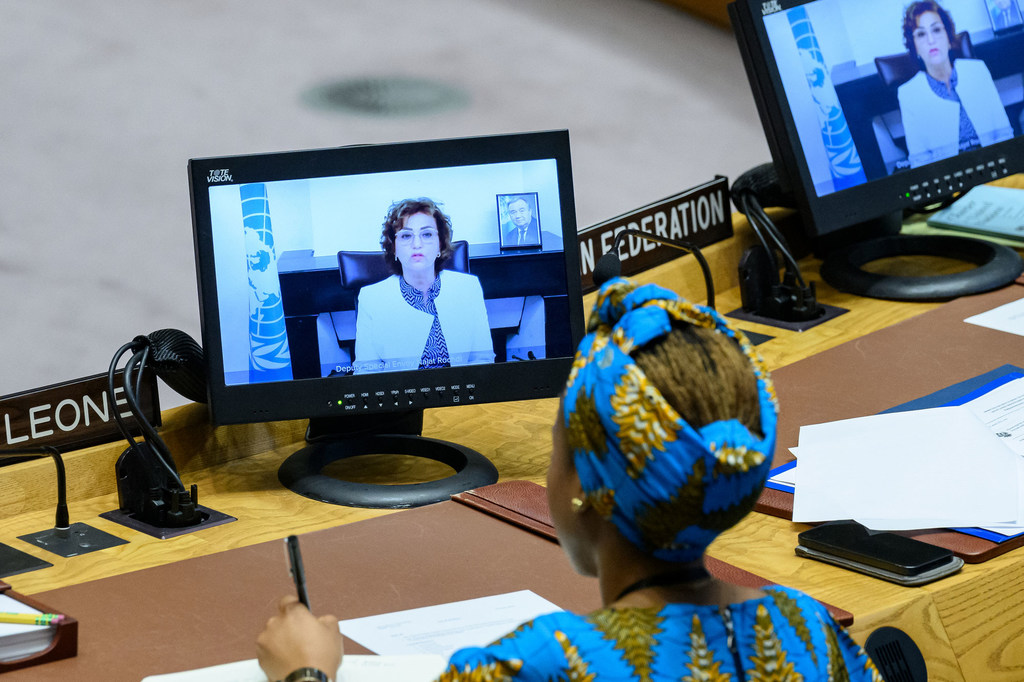 Najat Rochdi (on screen), Deputy Special Envoy of the Secretary-General for Syria, briefs the Security Council meeting on the situation in Syria.