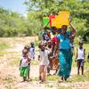 Women and children  collect water from a recently rehabilitated well point in Gwembe Valley, Zambia. (file)