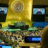 Volodymyr Zelenskyy (at podium and on screens), President of Ukraine, addresses the general debate of the General Assembly’s 79th session