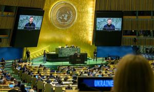 Volodymyr Zelenskyy (at podium and on screens), President of Ukraine, addresses the general debate of the General Assembly's 79th session