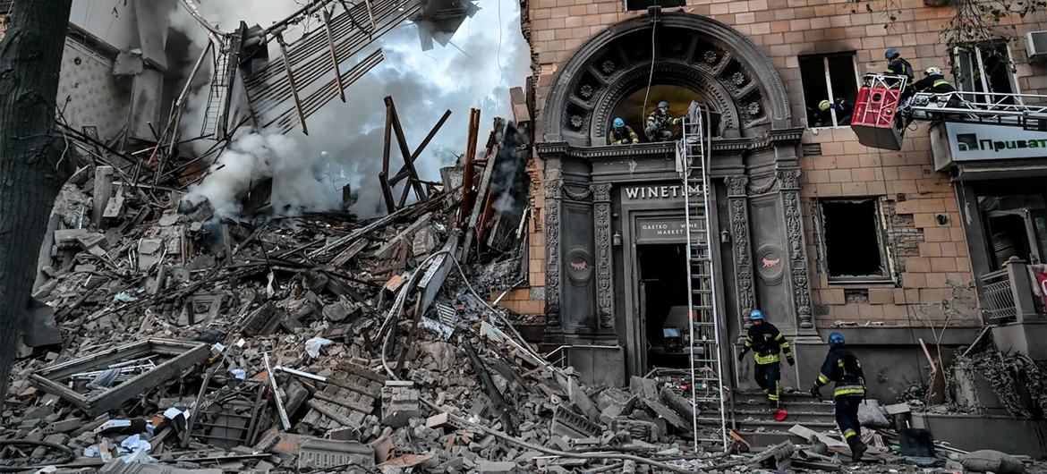 Rescue workers search a building damaged by missiles in Zaporizhzhia, Ukraine. Rescue workers search a building damaged by missiles in Zaporizhzhia, Ukraine.