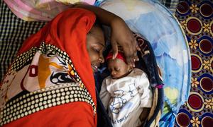 Through UNICEF’s mother support programmes, Mbene practised skin-to-skin contact & breastfeeding methods to help her premature babies grow healthy at home.