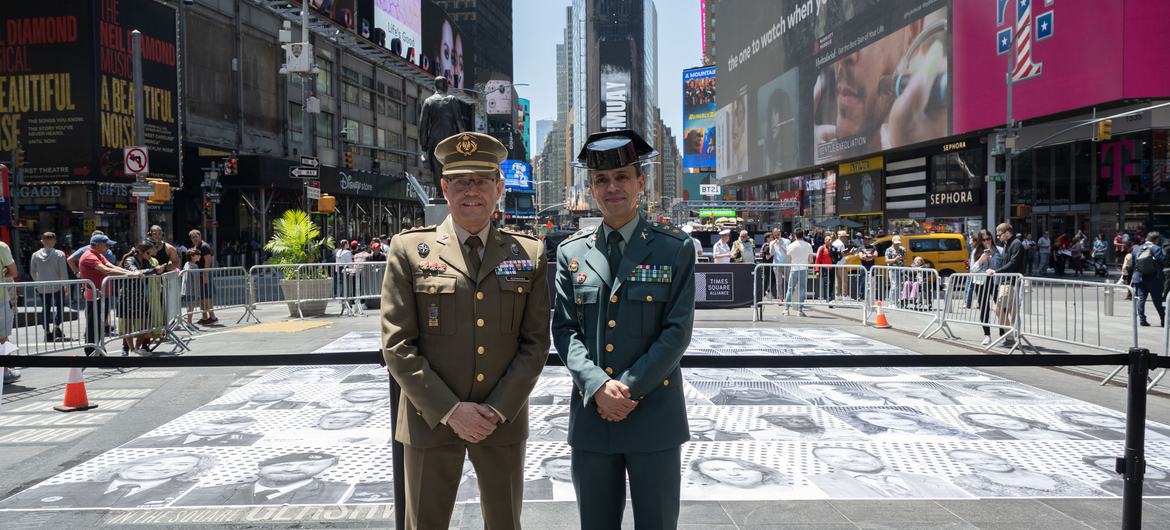 Two officers take part in the Inside Out Action event held to commemorate UN Peacekeeping's 75th anniversary in Times Square, New York City.