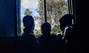 Young boys released from armed groups in South Kivu province, Democratic Republic of the Congo, look out of a window.
