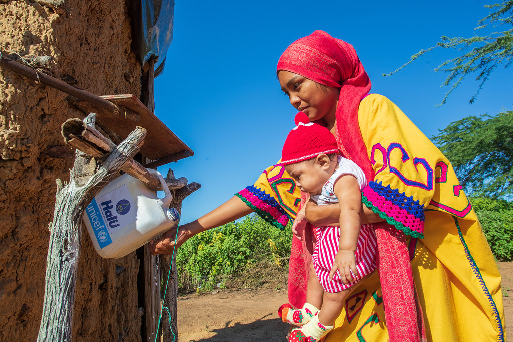In the municipality of Manaure in La Guajira, Colombia, a woman washes her hands at an installation of hand-washing point known as tippy taps. In the municipality of Manaure in La Guajira, Colombia, a woman washes her hands at an installation of hand-washing point known as tippy taps.