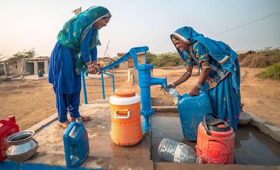 Women use a water pump provided by UNICEF in a village in Sindh province, Pakistan.