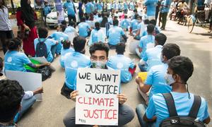 Youth activists sit in the street as a form of strike in solidarity with the Global Climate Strike in Bangladesh.