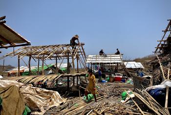 Internally displaced persons at a camp in Rakhine, Myanmar repair their shelters that were destroyed by Cyclone Mocha.