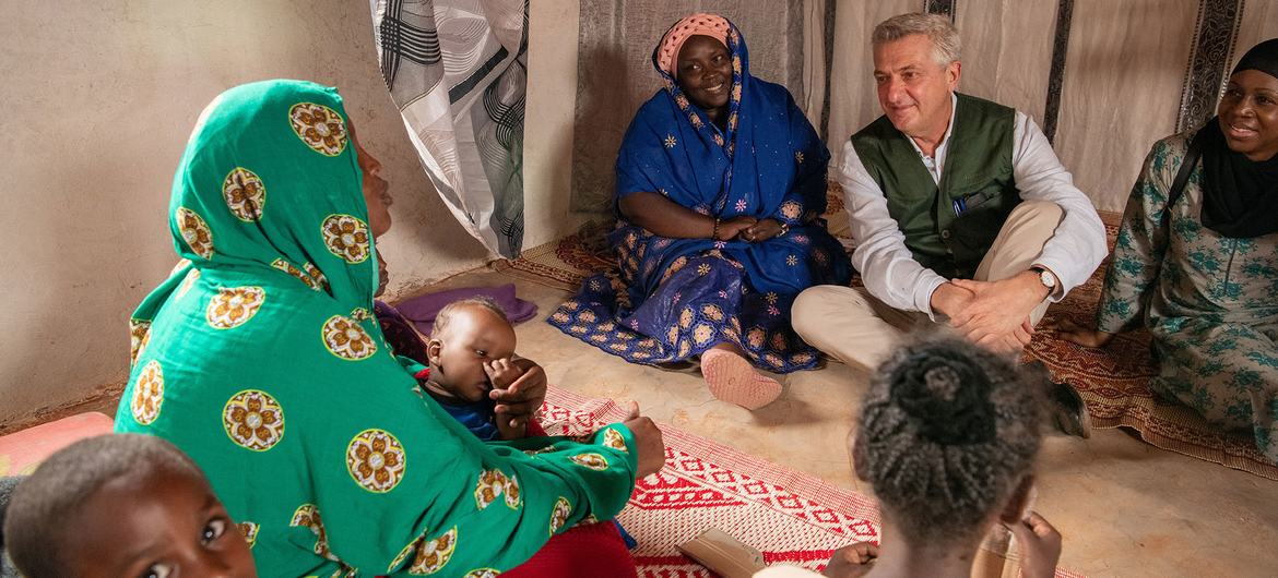 UN High Commissioner for Refugees, Filippo Grandi, interacts with an internally displaced family in South Galkayo in Somalia.
