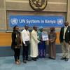 Mshindi wa kwanza na wa pili wa UN Person of the year awards wakitunukiwa na UNIS Nairobi.