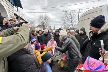 Denise Brown (centre), UN Resident Coordinator in Ukraine, visits Hroza, where a Russian strike killed 59 civilians as they gathered at a cafe on 5 October 2023.
