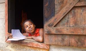 On 24 March 2021 in Manantantely, Madagascar, 17-year-old Mija Anjarasoa stares out of a window. She is part of the “catch-up class” programme at the Soanierana General Education College and aspires to become a midwife.