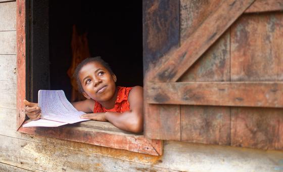 On 24 March 2021 in Manantantely, Madagascar, 17-year-old Mija Anjarasoa stares out of a window. She is part of the “catch-up class” programme at the Soanierana General Education College and aspires to become a midwife.