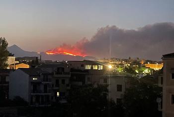 The forest fires in the northeast of Corfu island, Greece, can be seen clearly from Corfu town.