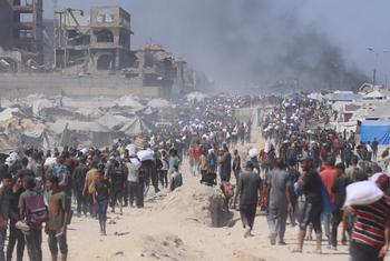 Palestinians in northern Gaza waiting to receive food aid as humanitarian aid trucks arrive to the area. The entire population of over 2 million people in Gaza is severely food insecure.
