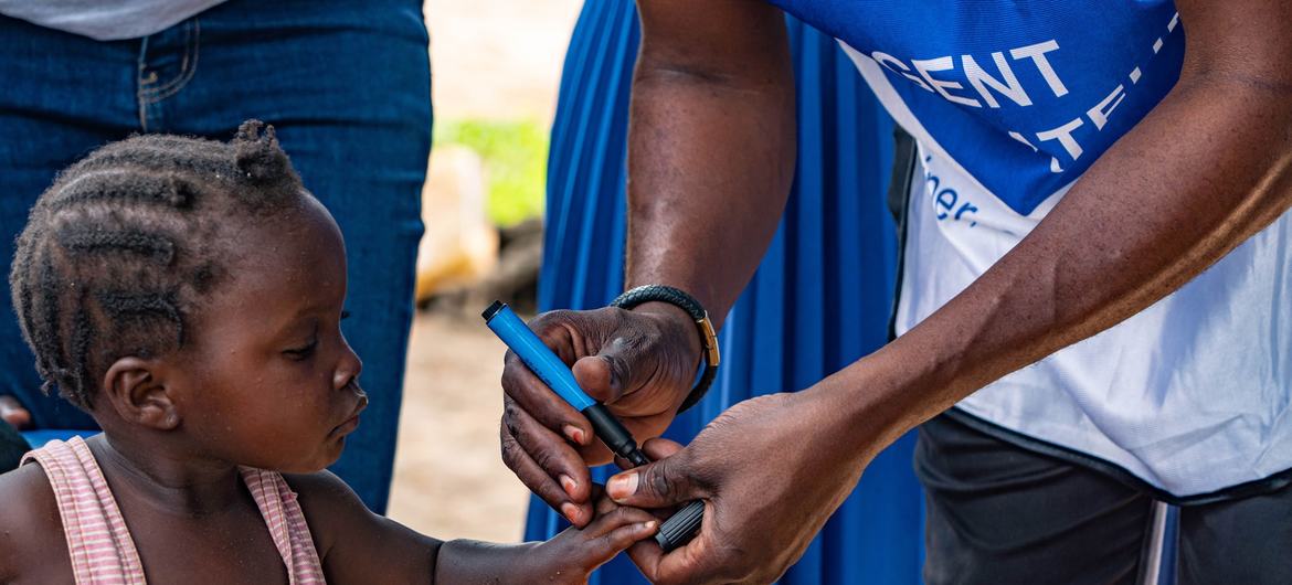 A child has her finger marked after receiving the polio vaccine in Kwango province, the Democratic Republic of the Congo.