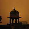 The dome of a Mosque in Pakistan as the sun rises.