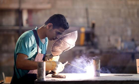 A young unemployed man receives job training in Lebanon. 
