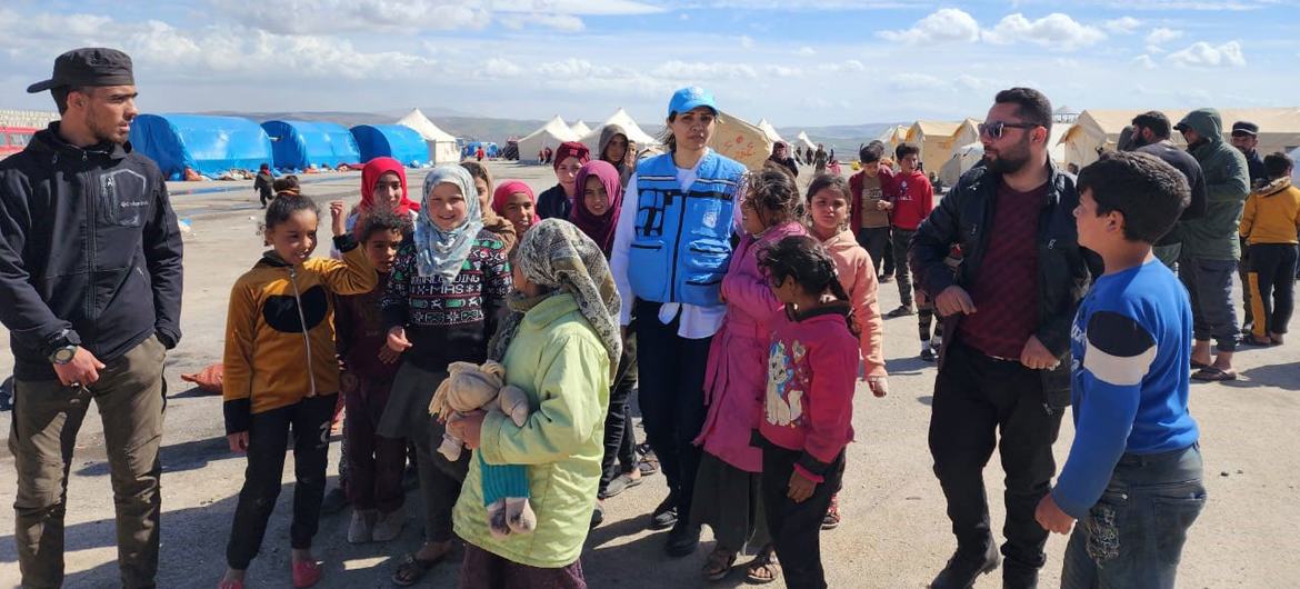 Shirin Yaseen (centre) visits a camp for displaced people in Jindairis in northwestern Syria.