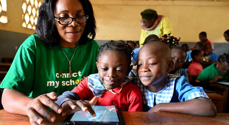 Young girls at a school in Yaoundé, the capital of Cameroon use a tablet during a lesson.