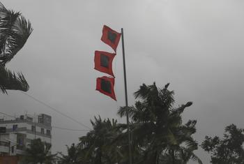 Three flags signifying "great danger" and "severe storm imminent" in village of Panjupara, Bangladesh, as Cyclone Remal is about to make landfall on 26 May 2024.