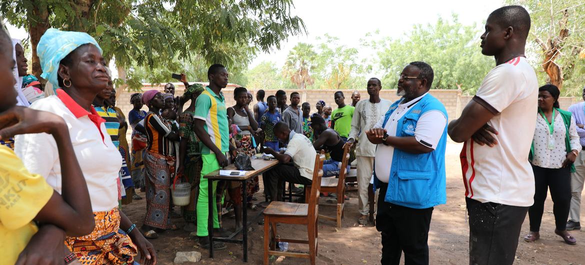 Refugees from Burkina Faso arrive in Togo after fleeing their country due to violence.