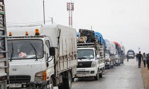 Trucks loaded with the belongings of former residents depart Areesha camp in northeast Syria.