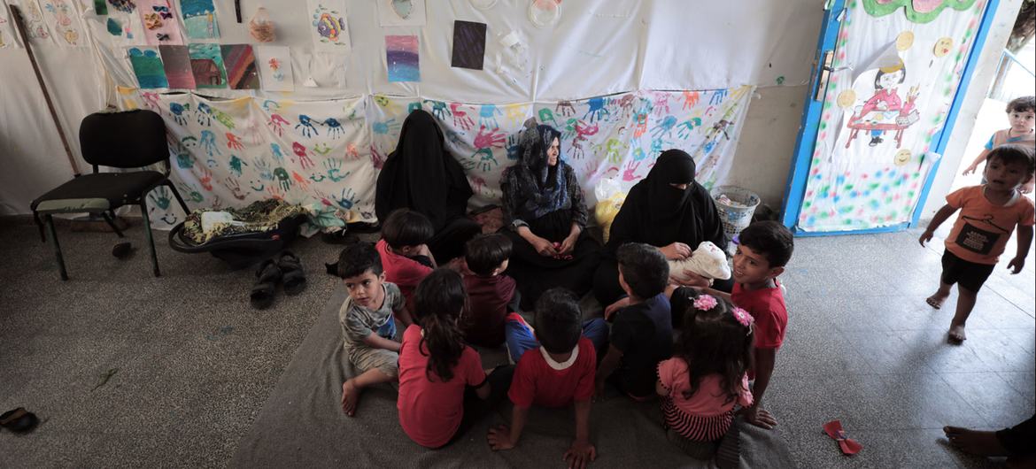 In response to a renewed escalation of violence, a Palestine refugee family find refuge at the UNRWA Beit Lahiya Preparatory Girls' School in northern Gaza.