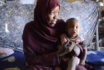 A Sudanese refugee, Sara (with her child) who gave birth on her own without medical assistance.