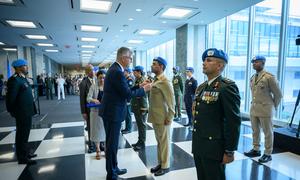 Jean-Pierre Lacroix, Under-Secretary-General for Peace Operations, presents medals during the Peacekeeping Military Police Medal Award Ceremony on the International Day of UN Peacekeepers.