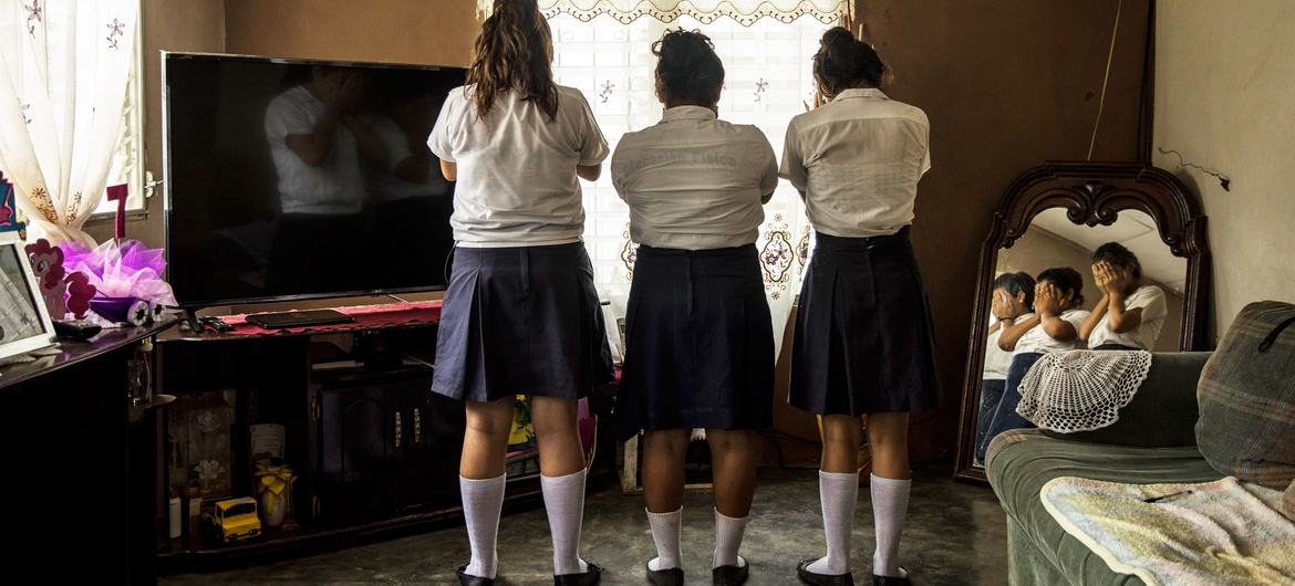 While walking home from school in Yoro, Honduras, the 13-year-old girl in the middle was grabbed, thrown into a van, beaten, raped and released one hour later.  
