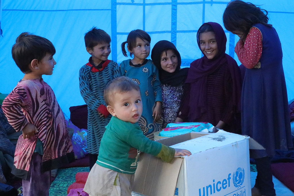 Displaced children livingi in Khoshi District in Afghanistan receive hygeine kits.