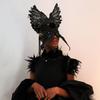Black swan dress by No Nation Fashion, powered by IOM Bosnia and Herzegovina, presented at 2022 New York Fashion Week event Mask made by Jase King.