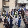 People gather outside a hospital in Quetta following the bomb blast in Mastung, Balochistan, Pakistan.