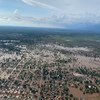 An aerial view of a flooded town in Bunj, Greater Maban County, South Sudan, with water covering the landscape and submerging parts of the settlement.