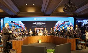 Members of the UN Security Council Counter-Terrorism Committee hold copies of the Delhi Declaration.