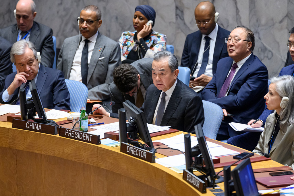 Foreign Minister Wang Yi (center) of China, addresses the Security Council meeting on the situation in the Middle East, including the Palestinian question.