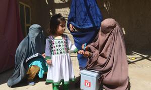 A child is vaccinated against polio during a polio mobillisation campaign in Kandahar, Afghanistan.