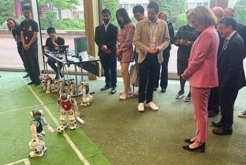 ITU Secretary-General Doreen Bogdan-Martin greeted by robot footballers at AI for Good Global Summit 2024, Geneva.