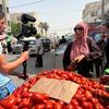 In Tunis, Tunisia, a female shopper complains about the lack of sugar in the country.