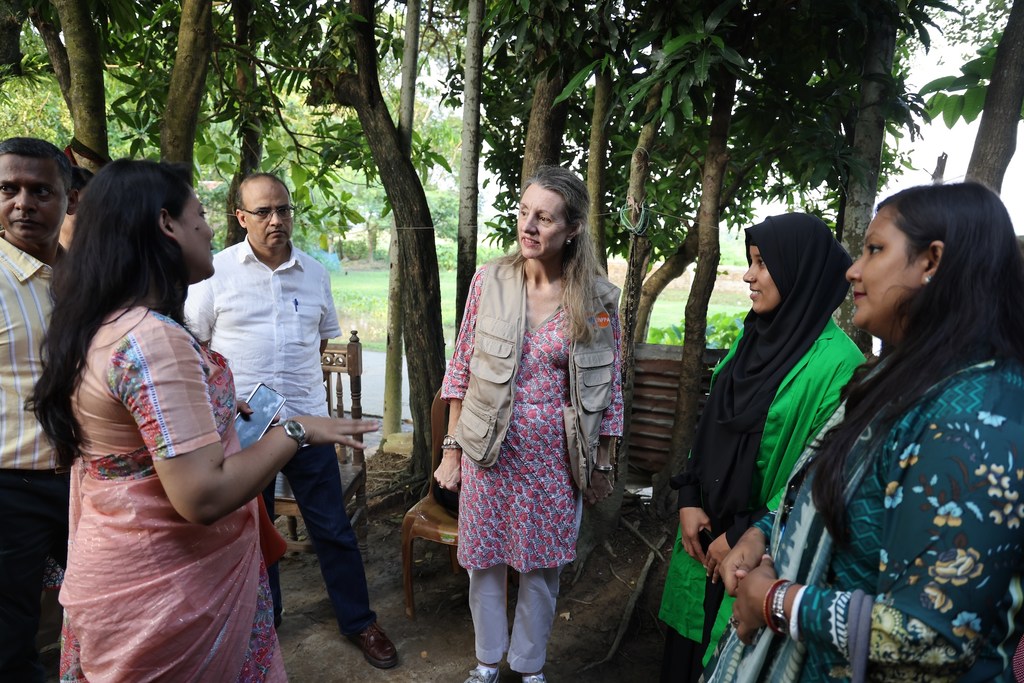 UNFPA Representative Catherine Breen Kamkong (centre) meets Shakila Begum (right, in green), a 26-year-old volunteer with the Climate Resilience Health System and Community Project in Sunamganj. UNFPA Representative Catherine Breen Kamkong (centre) meets Shakila Begum (right, in green), a 26-year-old volunteer with the Climate Resilience Health System and Community Project in Sunamganj.