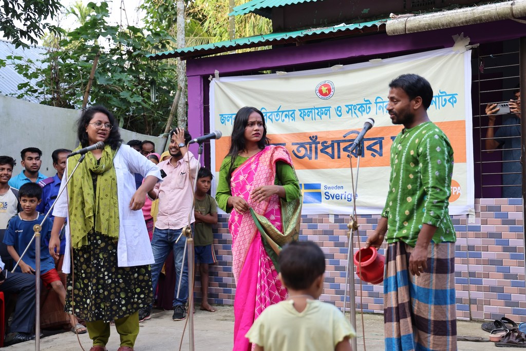 Villagers gather for an afternoon street drama in Bodipur, Kurban Nagar Union, Sunamganj, as part of the Climate Resilience Health System and Community Project. Villagers gather for an afternoon street drama in Bodipur, Kurban Nagar Union, Sunamganj, as part of the Climate Resilience Health System and Community Project.