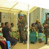 UN peacekeepers from Tanzania serving under MONUSCO in the DRC speak to women after delivering medical and food supplies at Mbau hospital in Beni, North Kivu province (file photo).