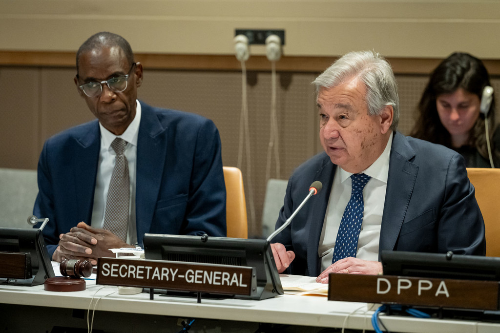 UN Secretary-General António Guterres speaking at a podium during a meeting with the Committee on the Exercise of the Inalienable Rights of the Palestinian People.