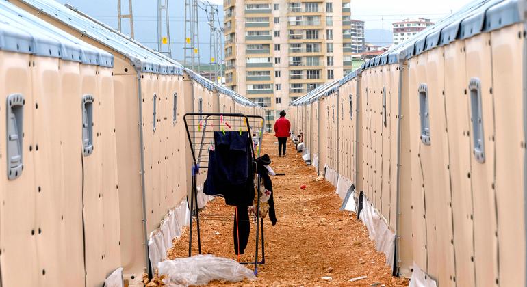 A person walks through a camp in Hatay, Türkiye, for people displaced by the February earthquake.